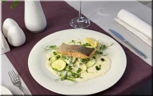 Trout fillet with zucchini, green peas and cream sauce photo Trout fillet with zucchini, green peas and cream sauce image