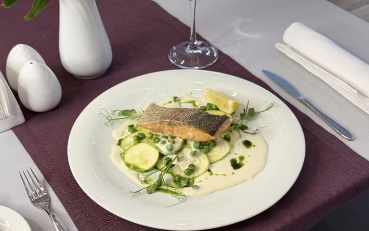 Trout fillet with zucchini, green peas and cream sauce image
